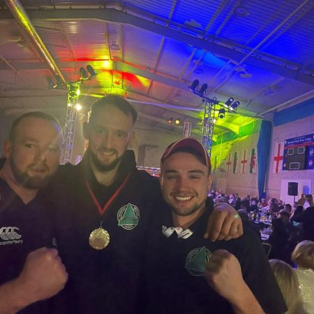 Photos of coaches with fighter after competition 1