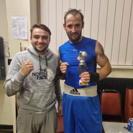 coach kieran gething with fighter after winning a fight