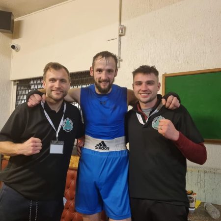 photo of coaches with fighters after competition 2